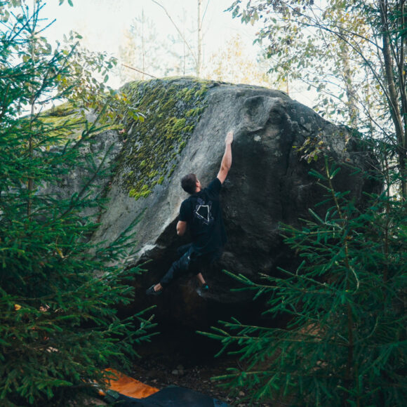 Depot Climbing athlete Sam Lawson climbing in Finland sporting a Wedge Climbing tshhirt