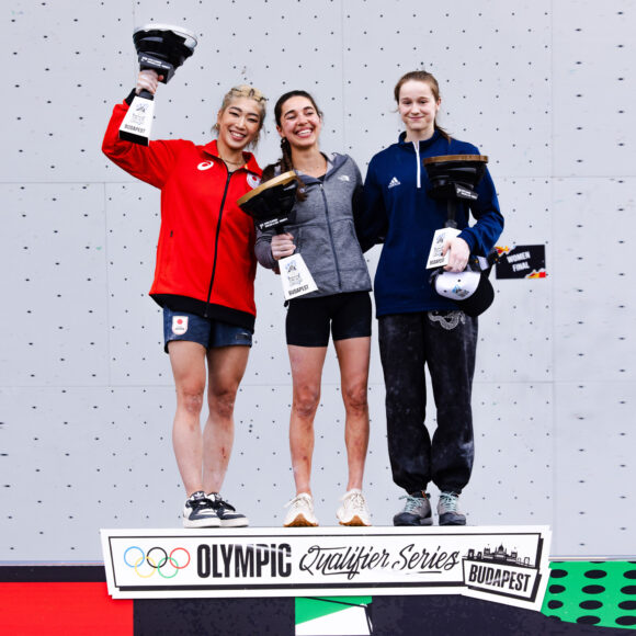 Erin McNeice on the OPlympic Qualifying Series podium alongside Brooke Rabatou and Miho Nonaka