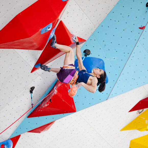 Molly Thompson-Smith leans back while lead climbing during qualification for the Olympic Games